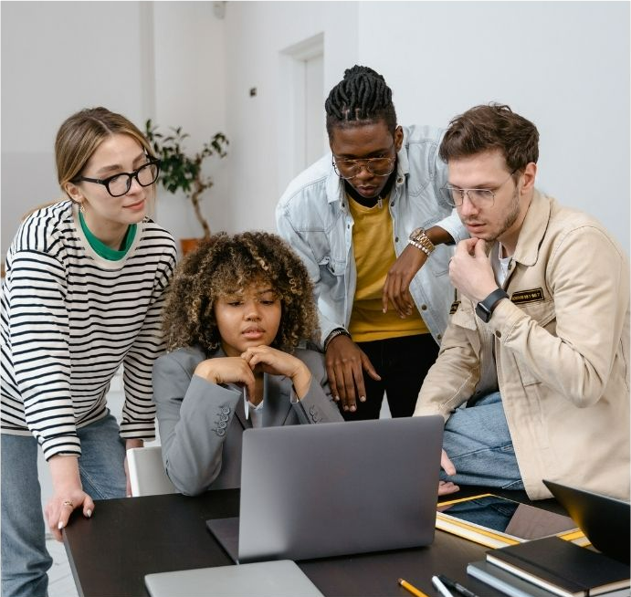 image of diverse workers looking at a computer